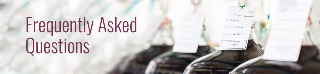 Frequently Asked Questions banner over a photo of carboys with handwritten record tags on their necks