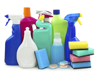 Assorted household cleaning products: spray bottles, detergents, sponges and cleaning tablets