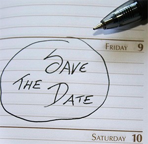 Save the Date handwritten and circled on a diary page between Friday 9 and Saturday 10, with a pen resting on it